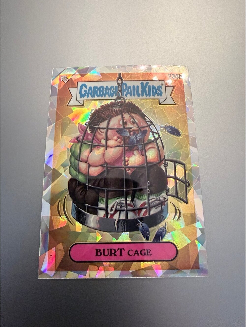 2023 Topps Garbage Pail Kids Burt Cage #234b Atomic Refractor Trading Card